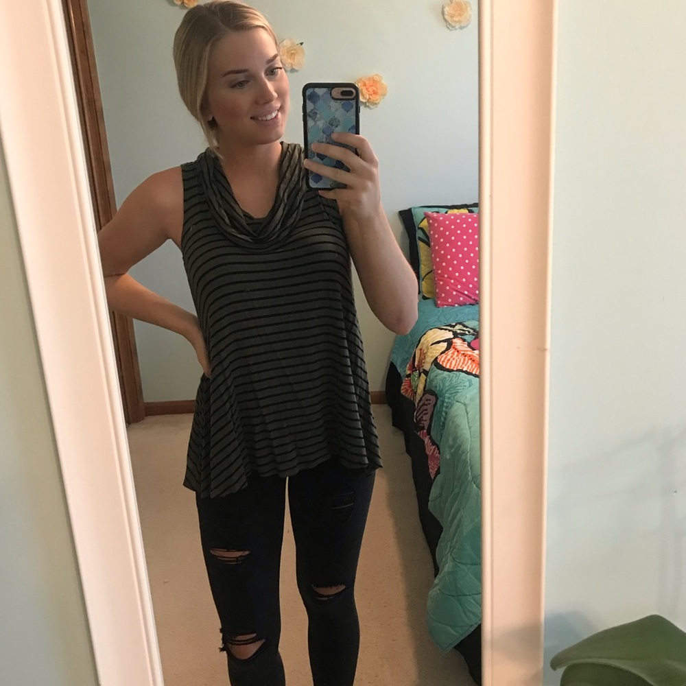 Sleeveless olive green top.